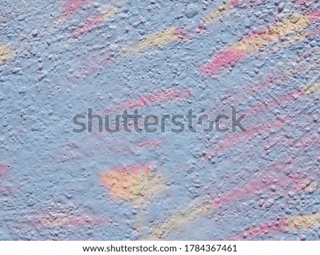 old cement wall painted with pastel paints. Texture and background