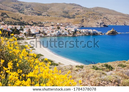 Greece travel, beach on Andros island, famous destination in Europe, panorama landmark with town buildings and sea, travel concept