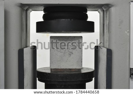 concrete cube tested in a UTM Royalty-Free Stock Photo #1784440658
