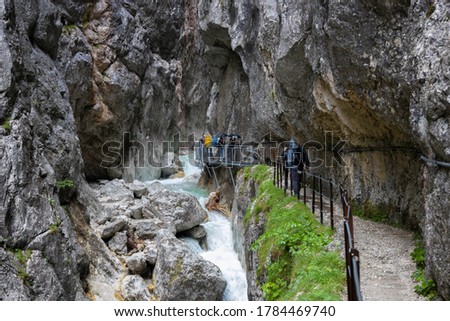 Hammersbach (Grainau - Garmisch Partenkirchen) - Tourists walking the path through the Höllentalklamm. Royalty-Free Stock Photo #1784469740