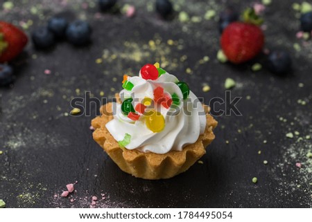 cake in a basket on a black background, front view