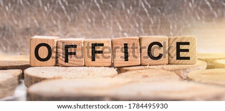 Wooden blocks with the word Office. Business and finance concept.