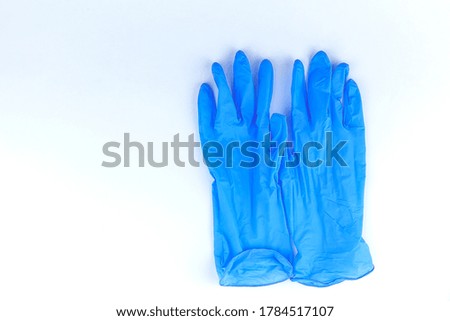 Blue surgical glove isolated on white background