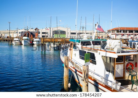 San Francisco Fisherman's Wharf harbor with moored boats on a clear sunny day. Copy space Royalty-Free Stock Photo #178454207