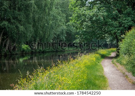 The path along The Bridgewater Canal in Cheshire, England  Royalty-Free Stock Photo #1784542250
