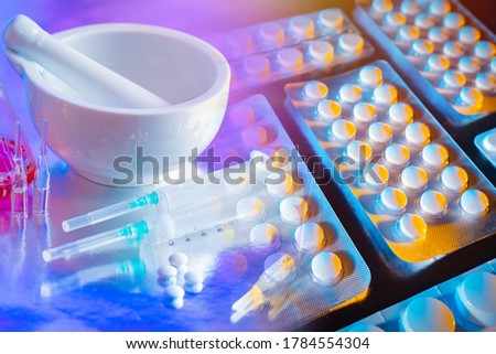 Pharmacology. The pharmacist's workplace. Production of prescription medication. Tablets research. Development of new vaccines. Medical treatment of diseases.