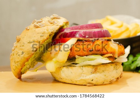 Delicious salmon hamburger with onion