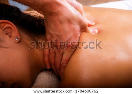 Photo of medical back massage. Relaxing treatments for women. Royalty-Free Stock Photo #1784600762