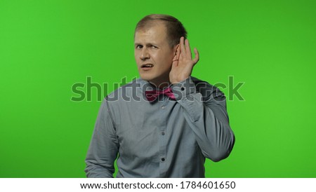 What. I can't hear you. Confused man having hearing problems, asking to say louder, difficult to listen quiet talk, misunderstanding in communication. Portrait of guy posing on chroma key background