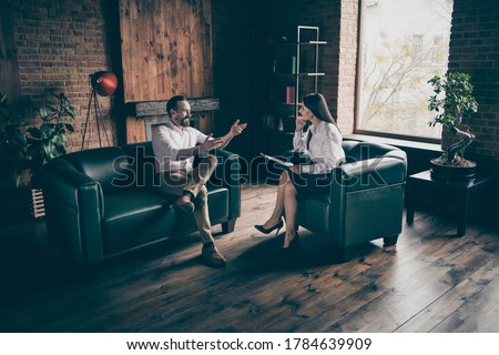 Full body photo of business man guy visit psychotherapist every week, session share good news listen advises formalwear clothes sit leather couch modern office indoors Royalty-Free Stock Photo #1784639909