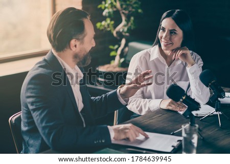 Photo of two business people corporate partners answer journalist press, conference questions speak mic political electoral campaign forum sit modern office indoors Royalty-Free Stock Photo #1784639945