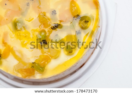 Cake with pieces of fruit in jelly on a white background