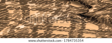 Background design texture, sandy sepia yellow silk fabric, abstraction, copyright print, military camouflage fleece fabric, your designs will allow you to be military,
