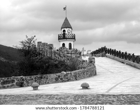 A greyscale low angle shot of the Victory Tower in Goynuk, Turkey captured on a cloudy day