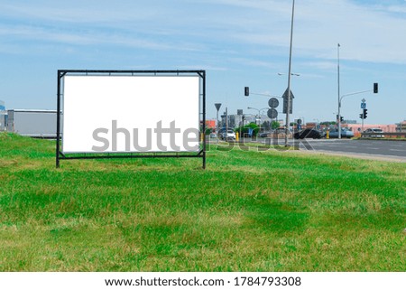 Advertising banner with white space for text on the background of city streets. Against the backdrop of city streets and green lawns