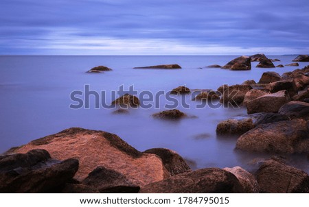 Soft Blue Zen-like Seascape over the Rocks in the Ocean