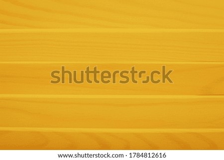 Yellow wooden boards background. Colored horizontal planks background.