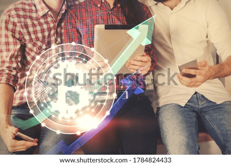 Double exposure of crypto theme drawing and man and woman working together holding and using a mobile device. Blockchain concept.