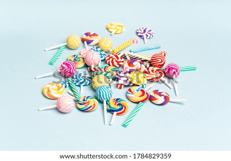 Lollipops isolated on blue background 
