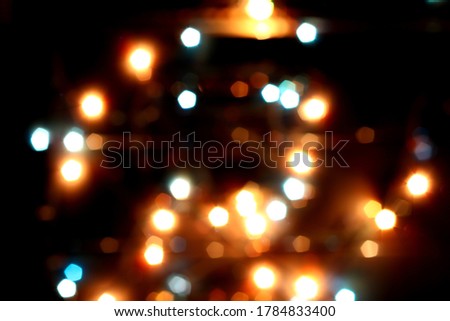 Blurred bokeh in warm colors. Lights and highlights for the background.