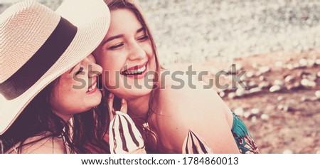 Friendship young girls have fun and hug in outdoor - portrait of couple of caucasian females stay together in love - lgbtq people free rights concept and happiness or joyful lifestyle
