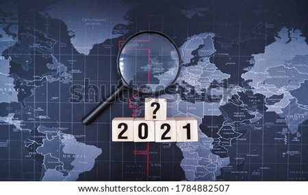 Magnifying glass with 2021 and question mark blocks. Cyber incident recovery planning concept, what is effective information technology disaster recovery due to business impact from coronavirus crisis Royalty-Free Stock Photo #1784882507