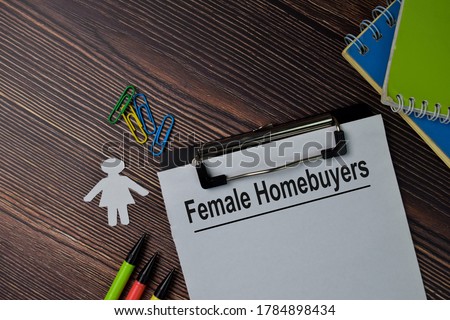 Female Homebuyers text write on paperwork isolated on office desk.