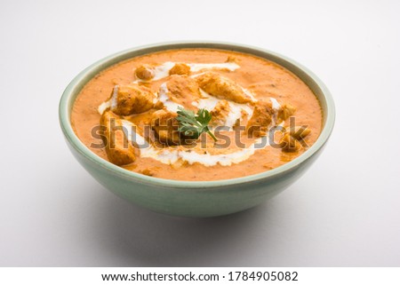 Tasty butter chicken curry or Murg Makhanwala or masala dish from Indian cuisine Royalty-Free Stock Photo #1784905082