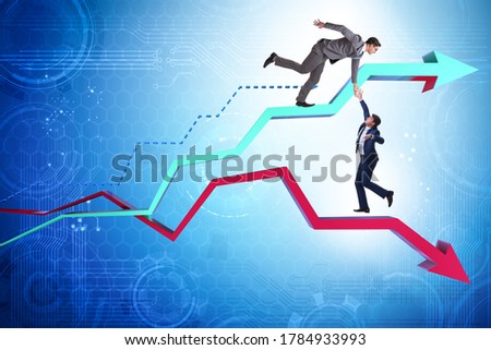 Businessman saving competitor during the crisis Royalty-Free Stock Photo #1784933993