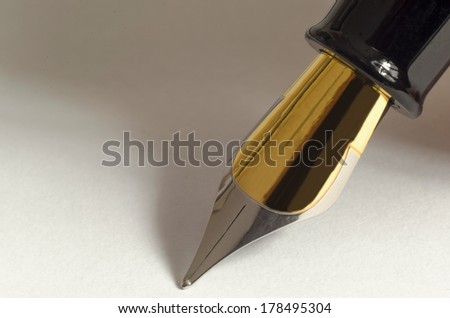 Macro picture of a fountain pen on a blank paper