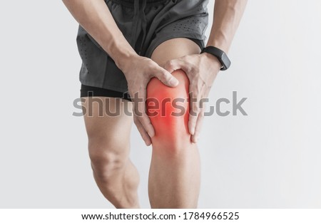 Joint pain, Arthritis and tendon problems. a man touching nee at pain point, isolated on white background Royalty-Free Stock Photo #1784966525