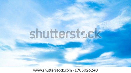 Beautiful blue sky and white clouds of various shapes with sunlight. Nature background Royalty-Free Stock Photo #1785026240