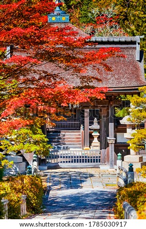 Japan Travel Destinations. Traditional Buddhism Shrine on Koyasan Mountain in Japan in Fall Season.Picture Taken During Red Maples Trees Season. Vertical image Composition