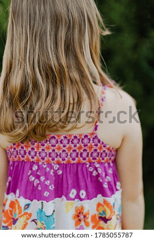 Girl in Pink and White Floral Dress
