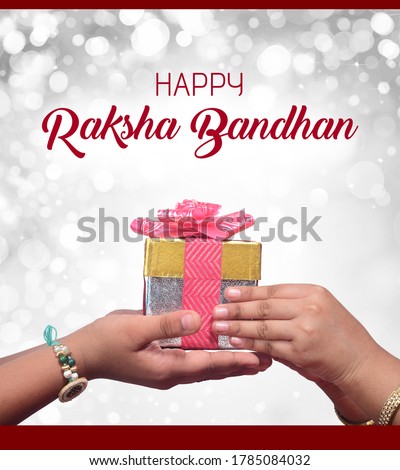 happy raksha bandhan (rakhi, rakshabandhan) concept. Indian brother giving gift to his sister