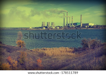 Vintage picture. Ukrainian thermal power station over the river