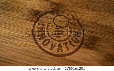 Innovation stamp printed on wooden box. New idea, success, progress, technology and inspiration concept.