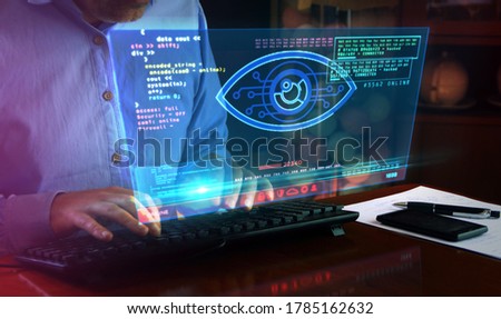 Hacker spy attack with cyber eye on computer screen. Hacking, control, surveillance, supervise, digital invigilation and breach of privacy concept 3d with glitch effect. Royalty-Free Stock Photo #1785162632