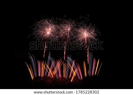 Colourful fireworks explosion displays on black background, isolated pattern design, asset for compostion