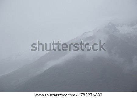 Foggy mountains, black and white photo, cloudy
