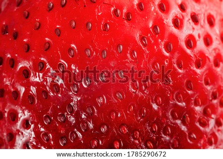 Bright red juicy strawberry closeup background