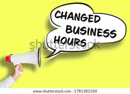 CHANGED BUSINESS HOURS poster or sign with megaphone and speech bubble against yellow background Royalty-Free Stock Photo #1785382100