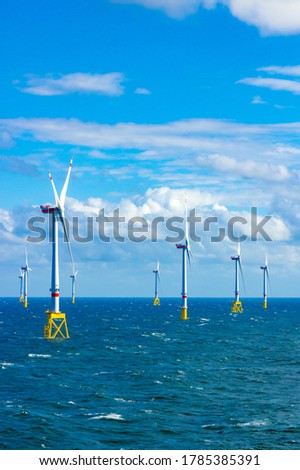 Offshore wind turbines at the North Sea Royalty-Free Stock Photo #1785385391