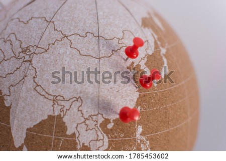 cork world ball showing china and with colored thumbtacks · plan destinations · visited places · next destination