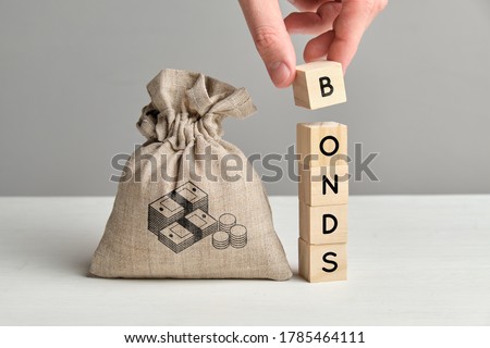 Concept of bonds and a bag of money Royalty-Free Stock Photo #1785464111