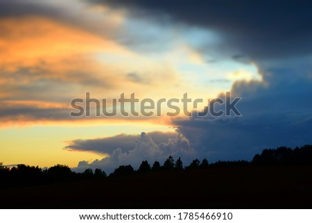 Colorful dramatic cloudy sky at sunset. Stock Photo