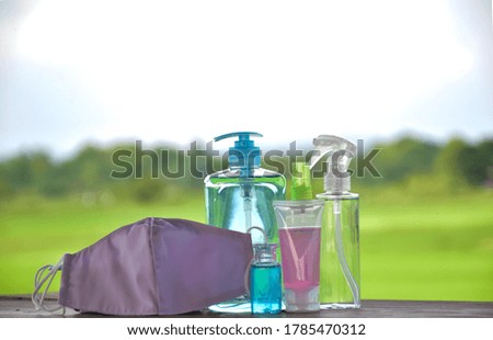 Medical equipments on table with natural landscape blurred background. Concept for protecting germs and coronavirus which is spreading over the world at the moment.