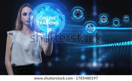 Business, Technology, Internet and network concept. Young businesswoman working on a virtual screen of the future and sees the inscription: Online training