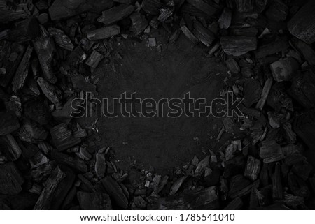 BBQ grill coal top view. Black charcoal texture background.