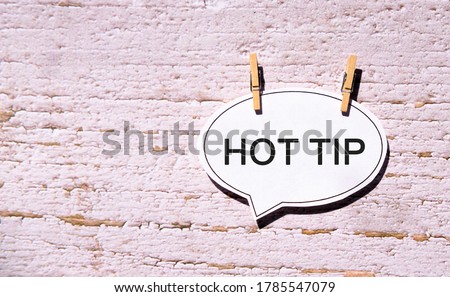 Hot tip on a white sheet with wooden pins